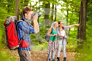 Photographer taking photo during hike