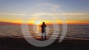 Photographer Taking Picture Of Magic Sunset On The Beach