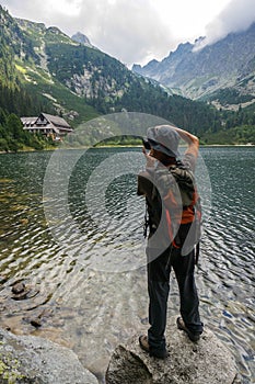 Photographer taking a picture in the mountains