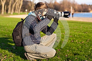 Photographer taking picture. Outdoor
