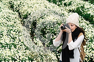 Photographer taking picture of the view of flower field