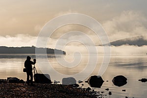 Photographer taking pictures of Loch Lomond