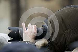 Photographer with telephoto lens photo