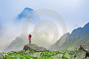 Hiker photographer on top of High Tatras mountain in Slovakia.