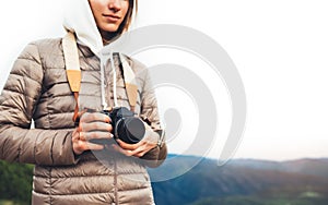 Photographer traveler on green mountain, tourist holding in hands digital photo camera closeup, hiker taking click photography, gi
