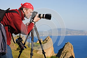 Photographer,tripod,sea,rocks photo