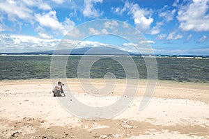 Photographer on tropical beach