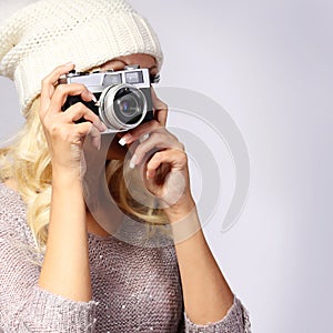 Photographer. Unrecognizable woman taking photo with film camera