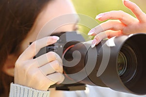 Photographer using camera to take photos