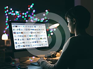 Photographer viewing pictures on the computer