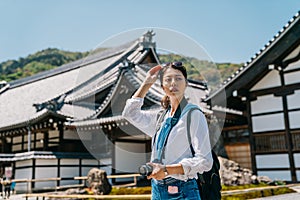 Photographer visiting Japanese traditional temple