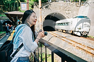 Photographer watching the train drive out tunnel