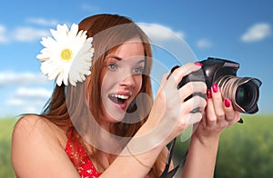 Photographer woman holding camera
