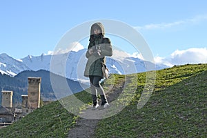 Photographer woman in the mountains of Mestia, Georgia