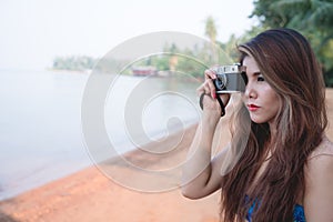 Photographer woman shoot photo camera with dslr outdoor.