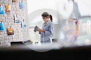 Photographer Working In Studio With Dslr Camera And Computer