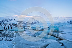 Photographers attempting to capture the glory of Jokulsarlon Glacier lagoon in Iceland