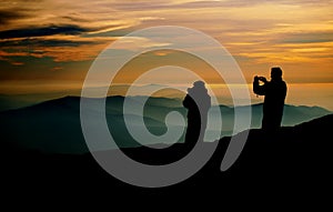 Photographers at sunset