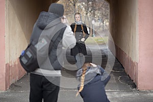 Photographers work with a model on the street