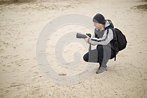 Photographers work with a model on the street