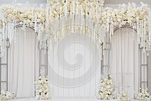 Photographic area is a stylish wedding decoration. Decorated with flowers, mini florals. Wedding photo zone with flowers.