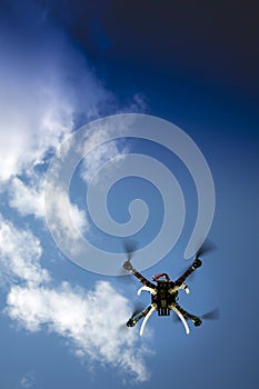 Drone in flight with cloudy sky