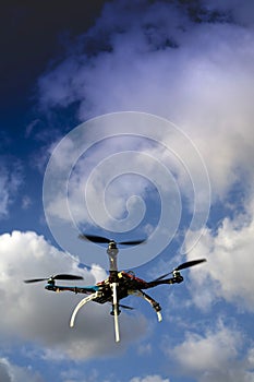 Drone in flight with cloudy sky