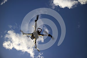 Drone in flight with cloudy sky