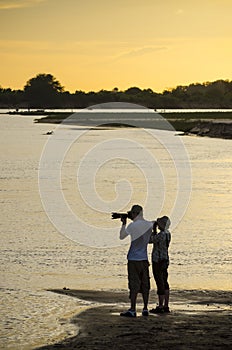 Photographing Rufiji river in sunset photo