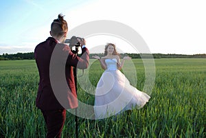 Photographing a wedding couple.