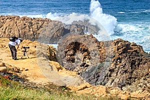 Photographing the wild waving ocean near Sines, Portugal photo