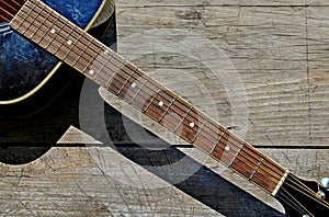 Photography of acoustic guitar neck