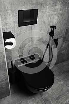 Photography of black matte bathroom details, with dark grey walls. WC area.