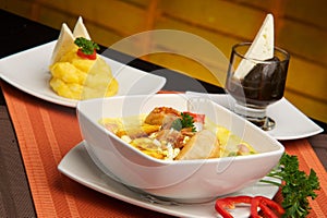 photography of a bowl of a traditional ecuatorian soup called Fanesca and mashed potatoes