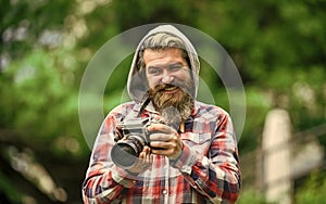 Photography business. Old technology. Journalist reporter. Professional photographer use vintage camera. Bearded man