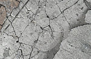 a photography of a close up of a crack in the concrete, a close up of a fire hydrant on a cracked sidewalk