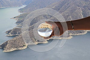 Zimapan dam landscape through crystal ball in hand photo