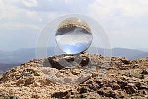 Zimapan dam landscape through crystal ball in rock photo