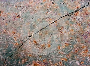 a photography of a crack in a concrete wall with a red and blue background, concrete surface with cracks and cracks in it