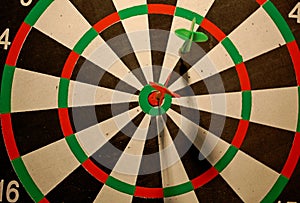 Photography of darts with dartboard