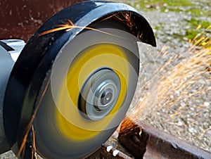 Electric angle grinder in work