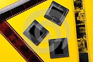 Photography empty slide frames on yellow background