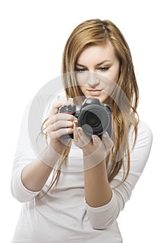 Photography is fun! Young beautiful woman photographer taking images with digital camera