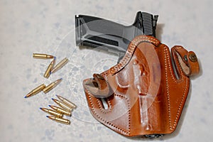 Hand gun in a holster.