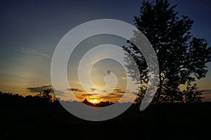 A Photography of nature, sunrise silhouette and trees.