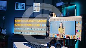 Photography organizing program displayed on monitors in multimedia agency, zoom out shot