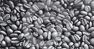 a photography of a pile of coffee beans with a black and white background