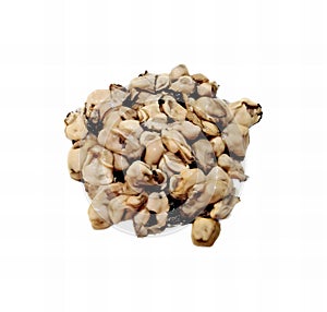 a photography of a pile of nuts on a white surface, there is a pile of nuts and other food on a white surface