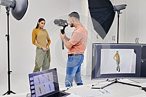 Photography, shooting and photographer with woman fashion model in studio for creative, advertising and image. Media