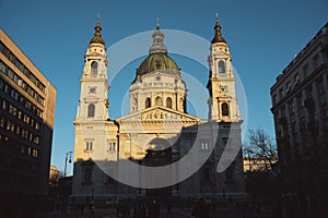 St. Stephen's Basilica in Budapest (Hungary) during sunset with clear blue sky - historical church